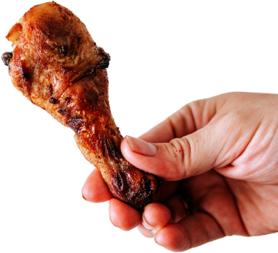 A hand holding a fried chicken wing